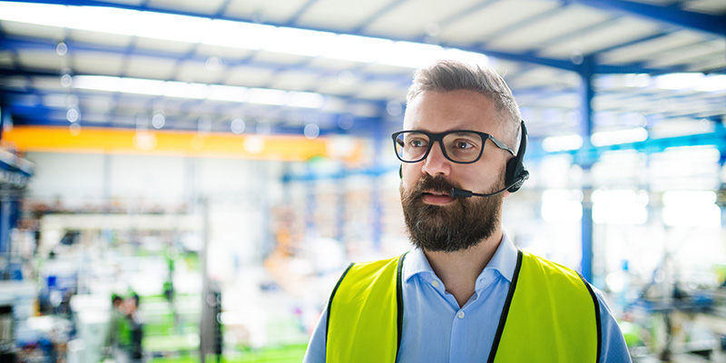 Technician or engineer with protective mask and headset working in industrial factory. Technician or engineer with protective mask and headset working in industrial factory.